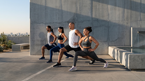diverse group doing lunges together during a fitness class at a wellness center in lakeville mn
