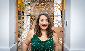 Photo of Gabriela Joglar smiling. Woman with brown eyes and brown hair.