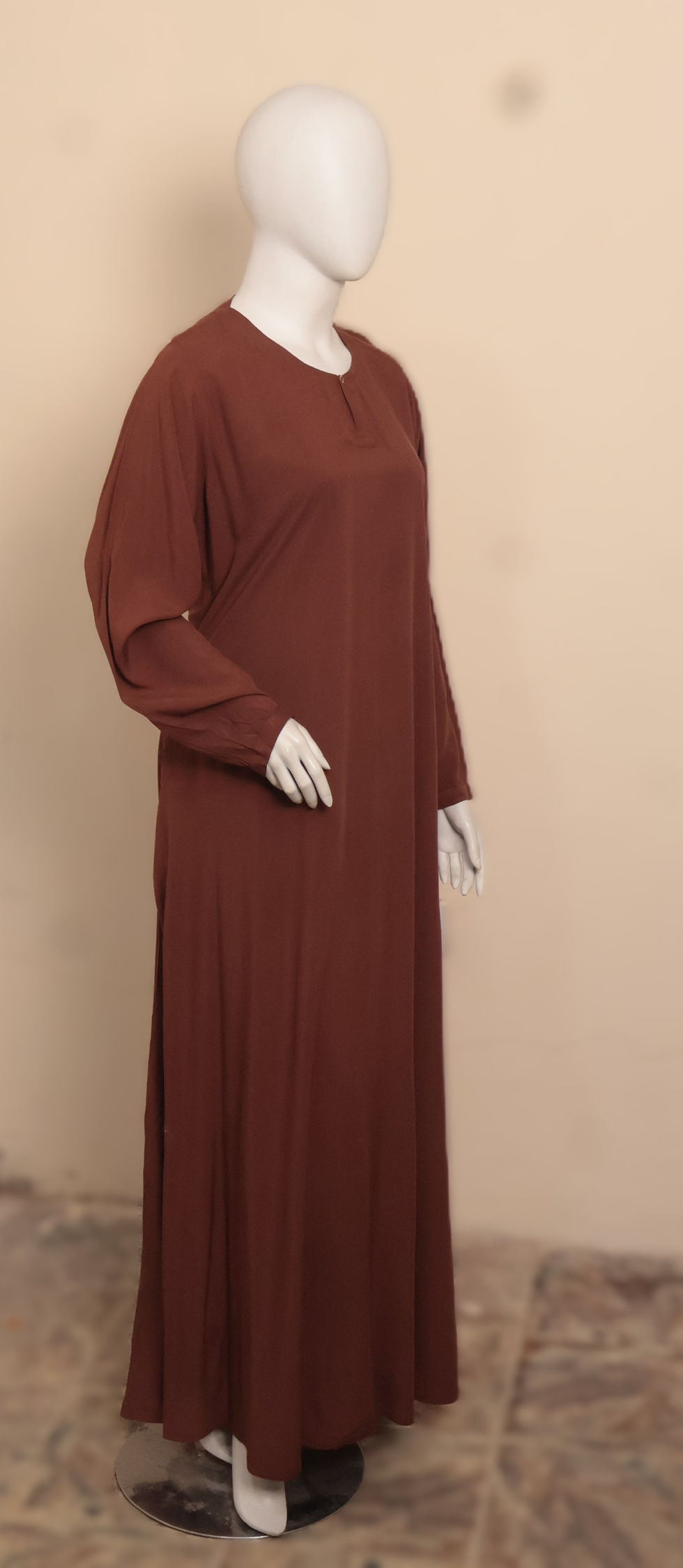 Thumbnail: he Serenity Edit Chocolate Brown Linen Abaya by Manalosha featuring breathable lightweight linen fabric, concealed zippered s