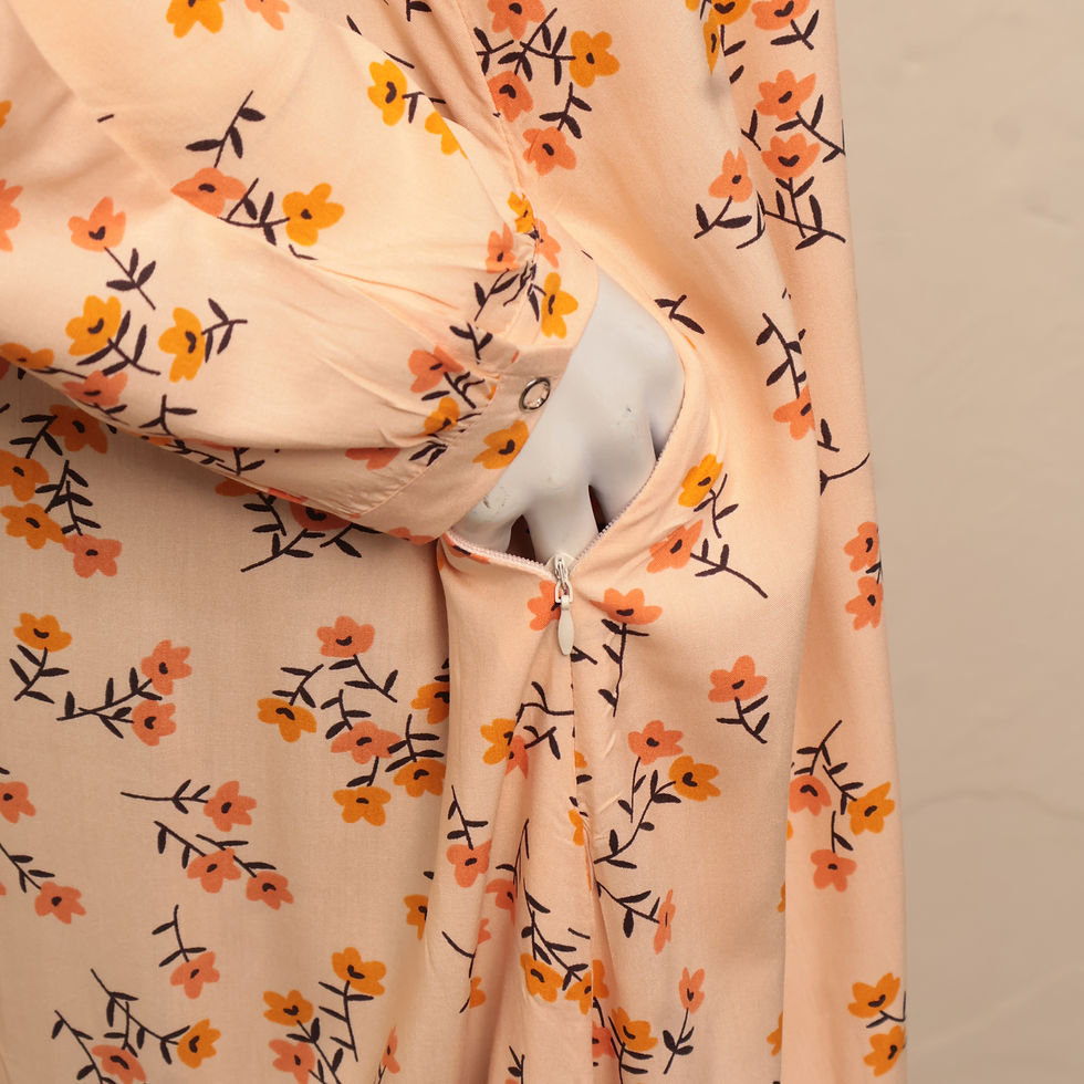 Thumbnail: The Serenity Edit Peach Blossom Printed Abaya by Manalosha featuring a lightweight peach floral print, long sleeves, and a re