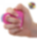 Hand holding a pink self-defense tool with blue electric arcs. Logo reads "Squeeze to stun." Neutral background.