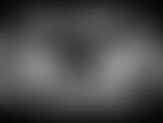 Laptop, clipboard, and office supplies in grayscale. Text: Gusto vs ADP RUN - Which payroll platform fits your company stage? Business theme.