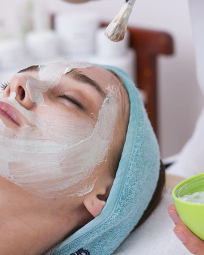 Blurred image of woman having laser hair removal on her legs