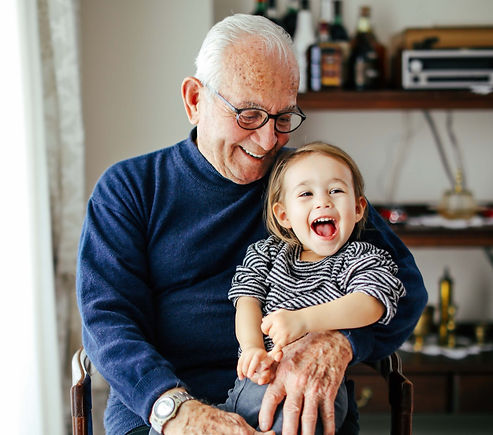 Grandfather holding his grandson smiling