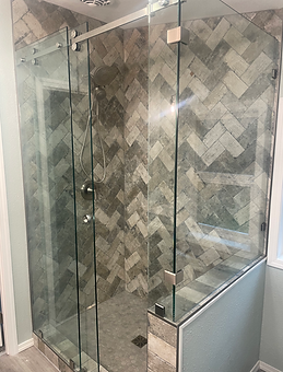Custom sliding shower door enclosure with chrome hardware