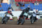 flat track racers battling it out of the turn