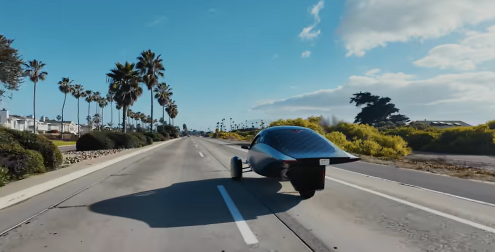 Aptera Solar Car driving toward the desert