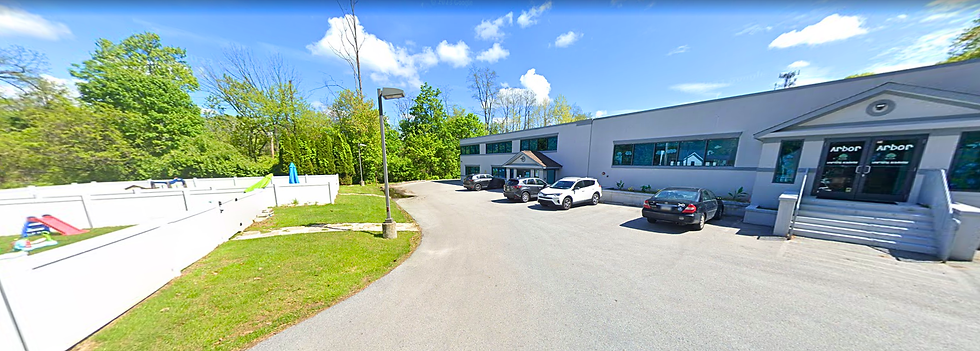 Malvern Academy facility featuring the main entrance, dedicated on-site parking area, and enclosed outdoor playground