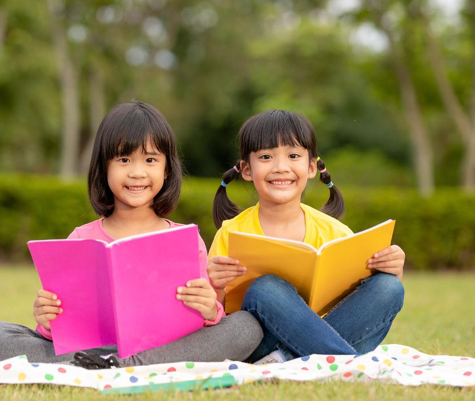 three-kids-reading-park_edited.jpg