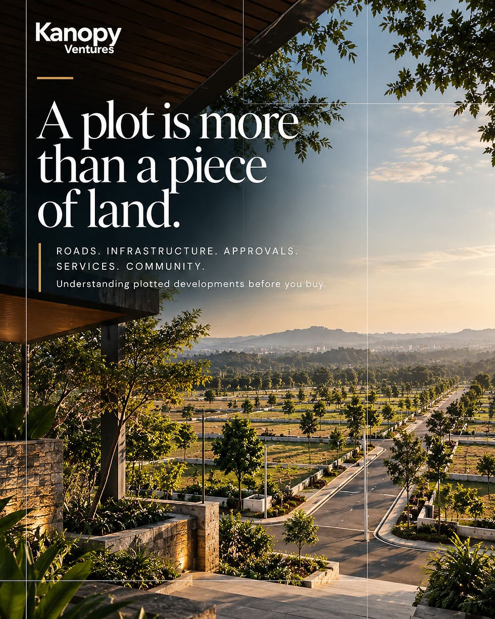 Aerial perspective overlooking a structured plotted development with asphalt roads, streetlights, green landscaping, and text reading "A plot is more than a piece of land.