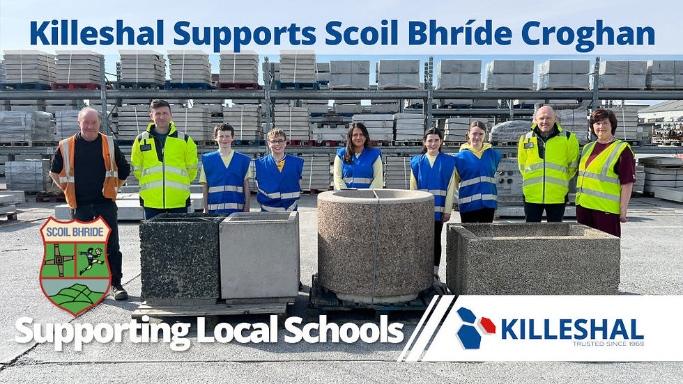 Teacher, students from Croghan School Offaly, and employees of Killeshal Precast in safety vests stand by their new concrete planters. Text: Killeshal Supports Scoil Bhríde Croghan. Supporting local schools.