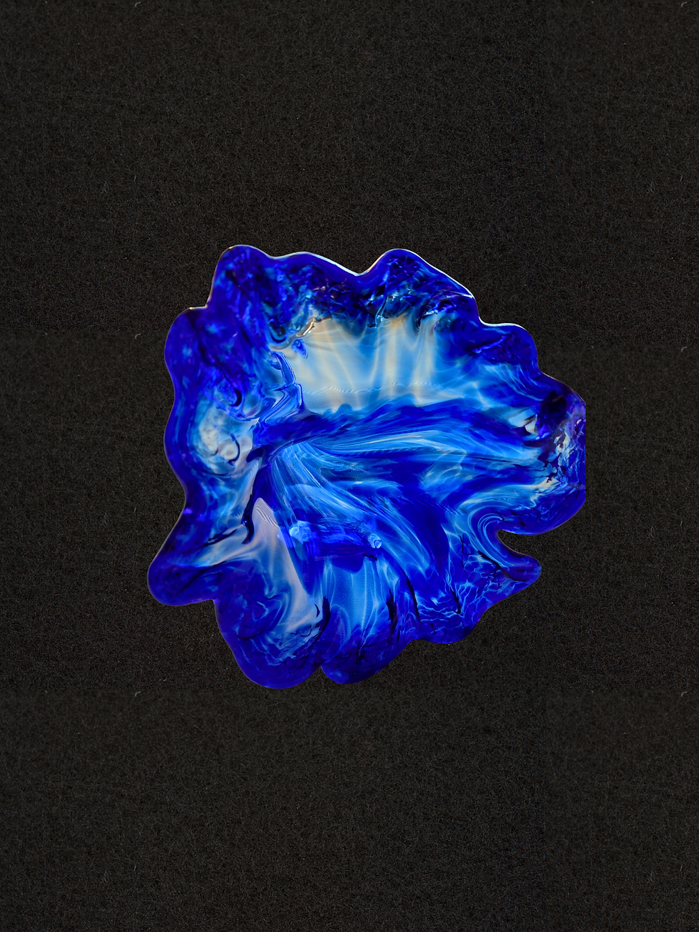 Handmade cobalt blue glass sculpture from Moab Art Glass, featuring a curling stem and ruffled bloom form. One-of-a-kind hand