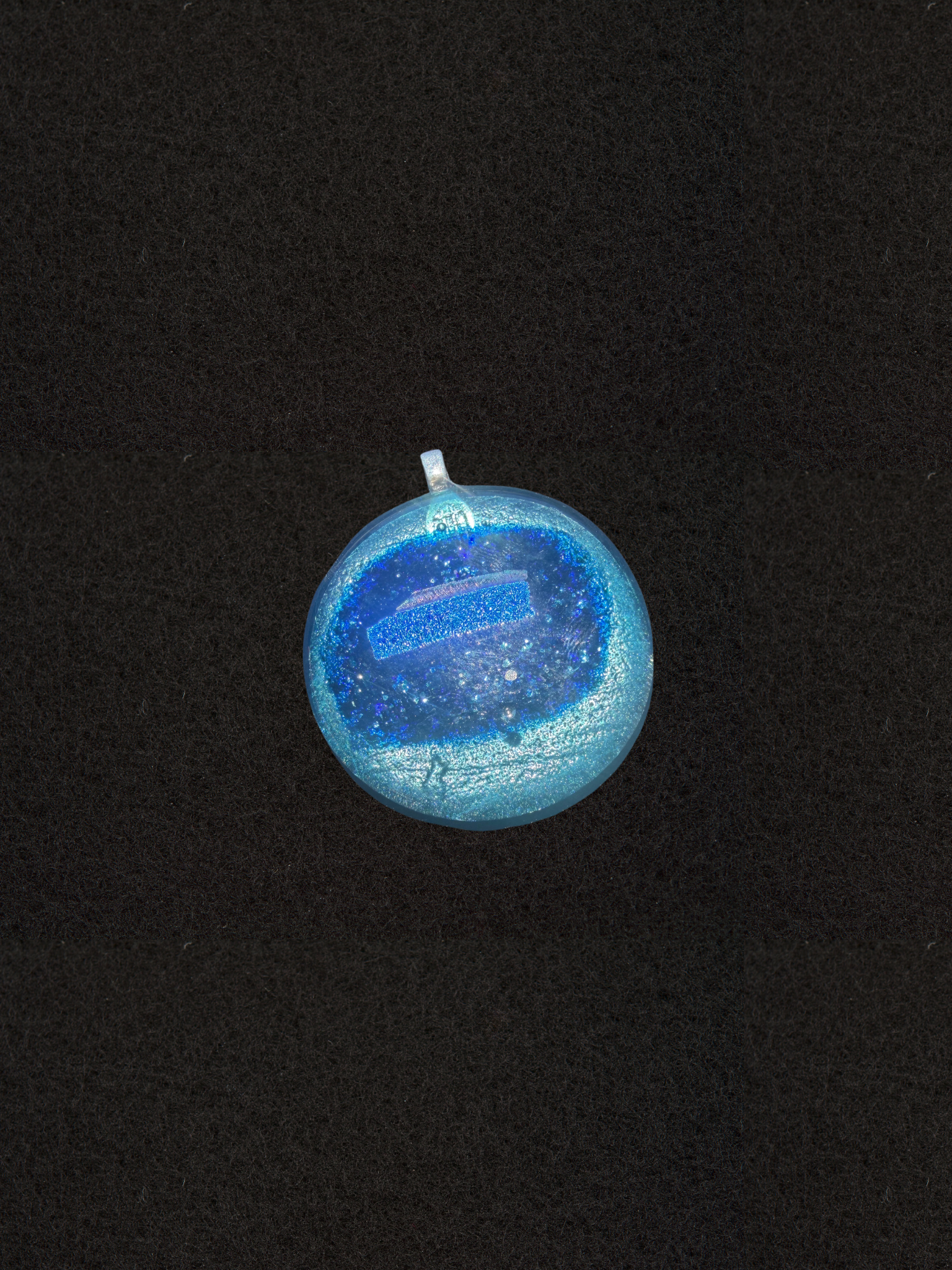 Round Cosmic Blue necklace pendant, dark starry sparkle with a pale blue center band