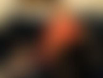 Girl in glasses with naked foot blows balloons