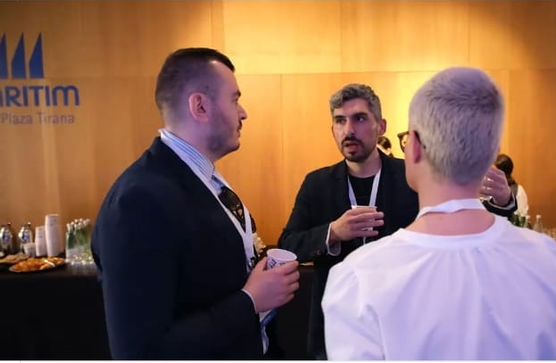 Armin speaking with colleagues during Meta conference