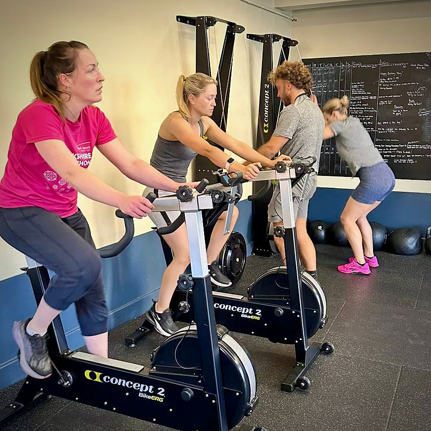 Gym members on the Bikes and SkiErgs