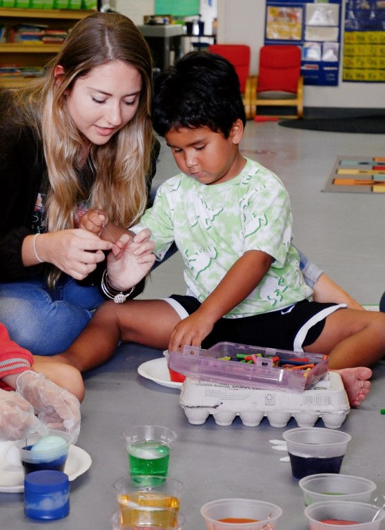 Child learning behavioral skills through one-on-one instruction