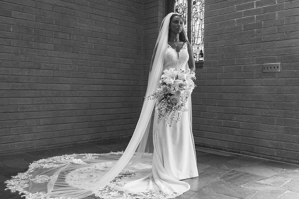 bride looking afar holding her bouquet