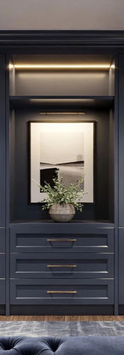  Luxurious navy blue custom walk-in closet with built-in storage and island – Hada Interiors Cheshire design.
