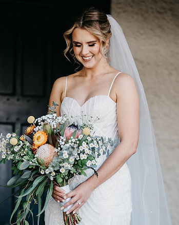 Darlington bride Alicia wearing a low bun bridal hairstyle by Ahead of Style Hair Artistry