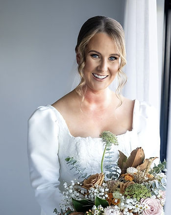 Caversham bride Kendall with a polished low bun bridal hairstyle by Ahead of Style Hair Artistry