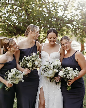 Dwellingup bride Tenille wearing a Low curled bridal bun hairstyle by Ahead of Style Hair Artistry