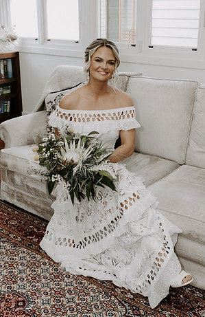 Perth bride wearing a textured low bun hairstyle by Ahead of Style Hair Artistry.