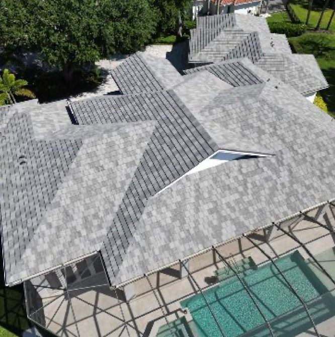 Tile roof installation finished on Naples home with a grey blended concrete flat tile