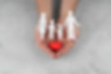 hands-holding-paper-people-heart-close-up.jpg