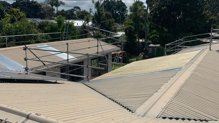 Before roof painting of an Auckland home by Smart Painters