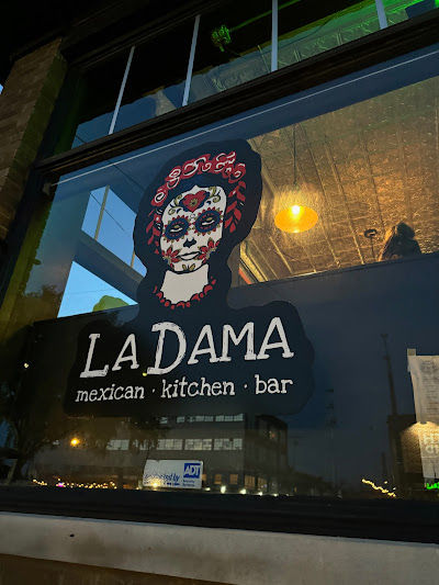 La Dama Mexican Kitchen Bar sign with sugar skull
