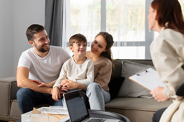 close-up-family-discussing-with-therapist.jpg