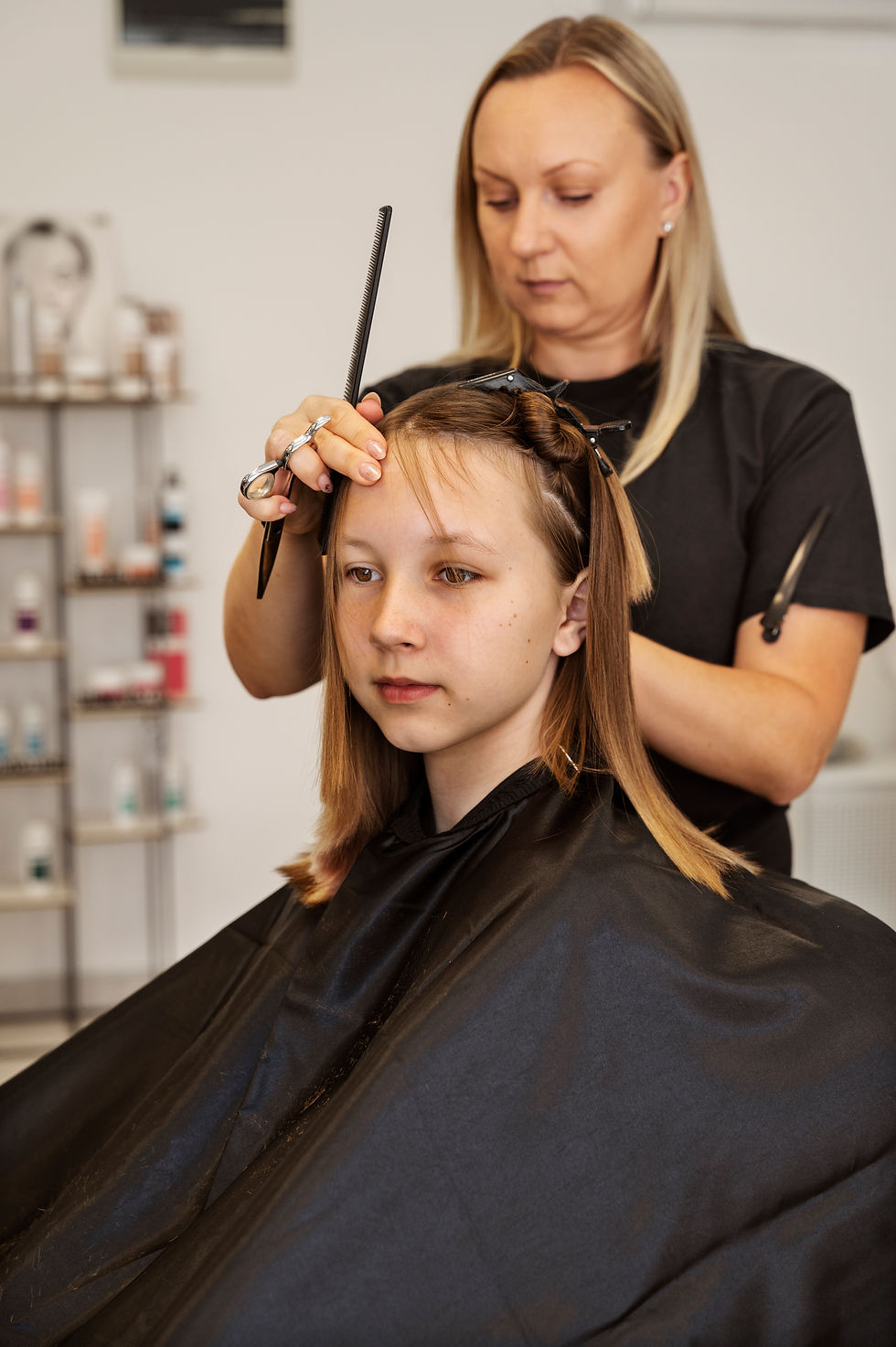 girl-getting-haircut-salon-side-view.jpg