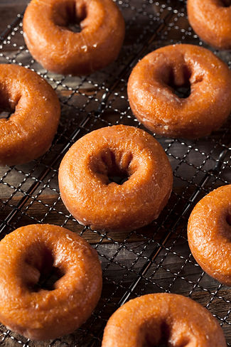 homemade-glazed-autumn-pumpkin-donuts-P2MJY9C.jpeg