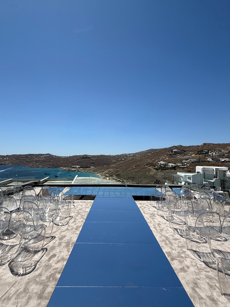 Elevated mirrored aisle and wedding stage available for rental in Mykonos and Greece. Ideal for outdoor ceremonies, garden receptions, and luxury hotel weddings. Surface finish can be customized based on concept or palette.
