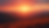 Eye-level view of a fantasy landscape with rolling hills and a vibrant sunset