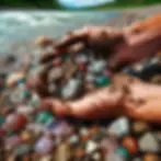 Close-up shot of hands sifting through gravel and dirt at the Souris River, revealing colorful gemstones.