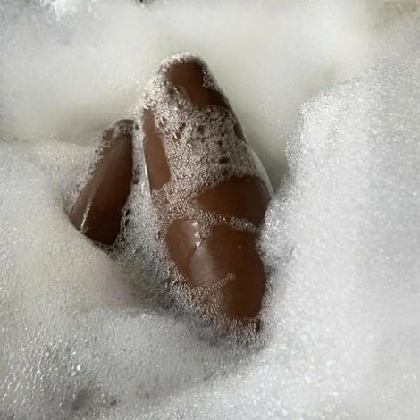 Body in bathtub bubbles.