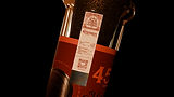 Mohabbat whisky bottle neck detail, close-up of luxury spirits packaging capsule and wax seal, De Icebreaker
