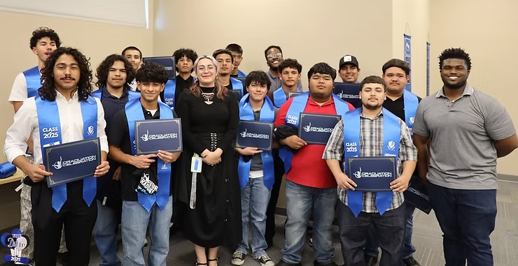12th-grade IYT Brothers posing for a group photo at their graduation ceremony.