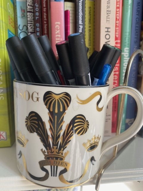 mug with pens.jpeg