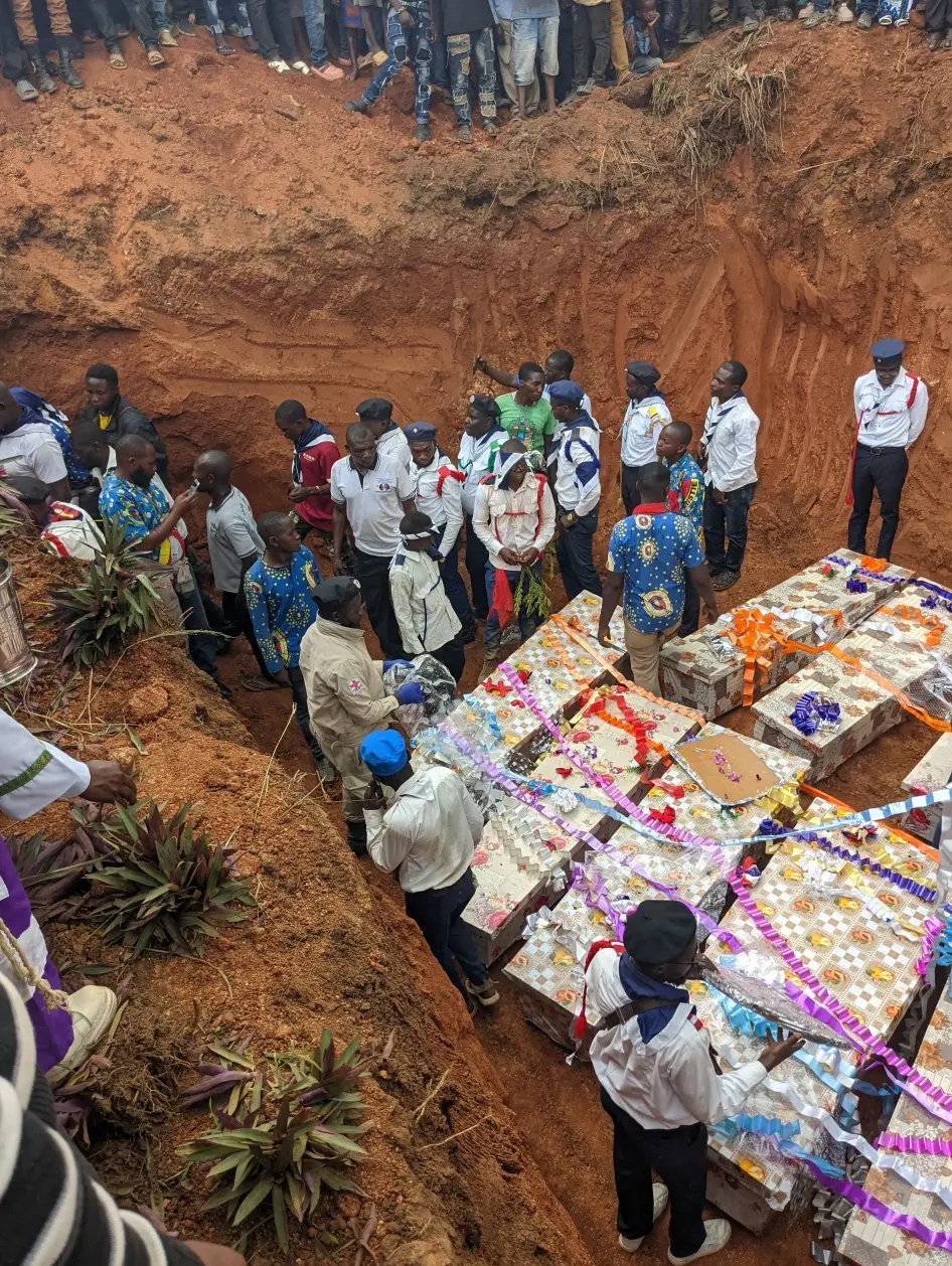 The burial of people killed by the Allied Democratic Forces armed group at a church in Komanda, Ituri province, in eastern Democratic Republic of Congo, July 28, 2025. © 2025 Reuters/Stringer