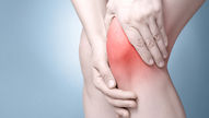 Knee pain with hand around knee