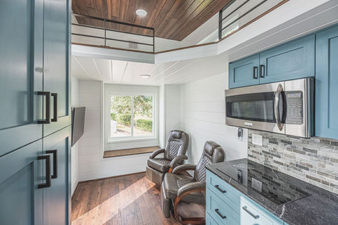 Cat House tiny home on wheels living area by Movable Roots.