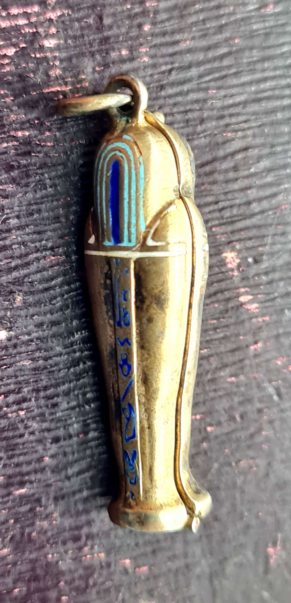Thumbnail: Silver Egyptian Revival Opening Enamel Mummy's Tomb & Mummy Pendant, c.1910
