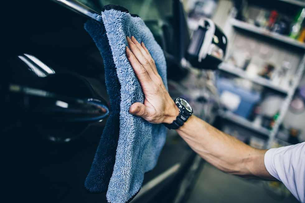 Using a microfiber towel to level a ceramic coating for a final shine