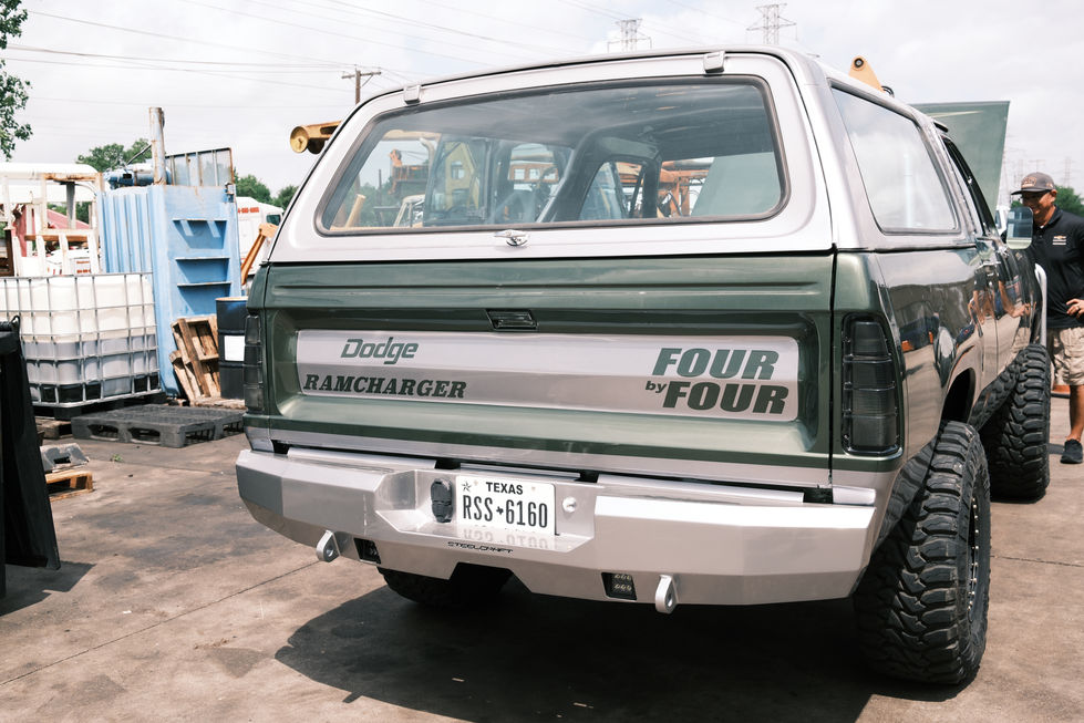 Green and white vintage SUV with "Four Door" label.