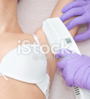 stock-photo-23119955-young-woman-receiving-laser-epilation-treatment.jpg