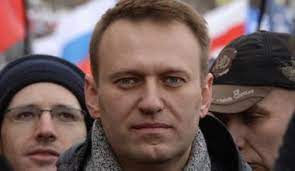 Man speaking to a group of people.