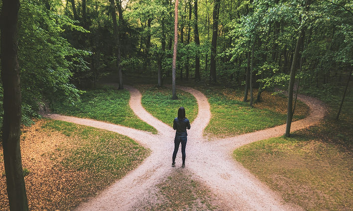 a person sitting at a crossroards